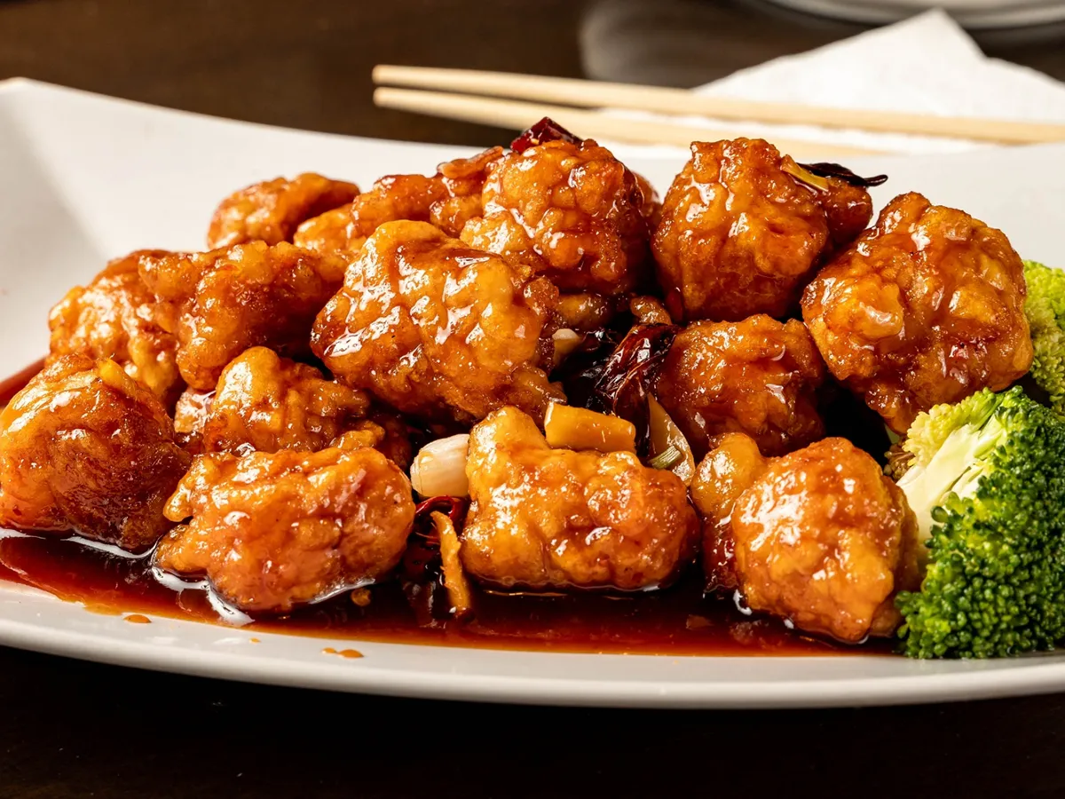 Braised spicy crispy chicken chunks with rich glossy sauce at Lee's Garden, a Chinese Restaurant in Rosenberg