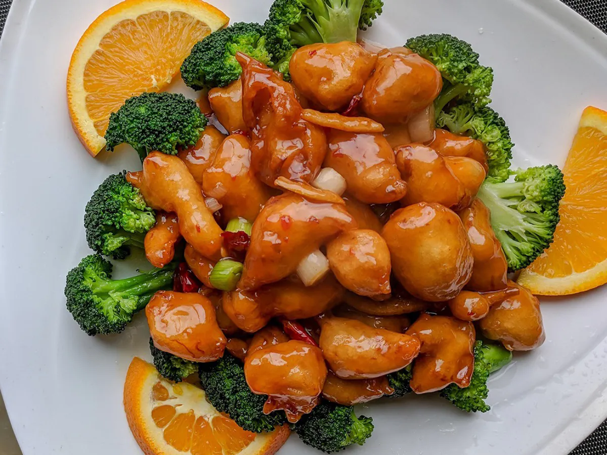Sweet orange glazed chicken with fresh broccoli and orange slices at Lee's Garden, a Chinese Restaurant in Rosenberg